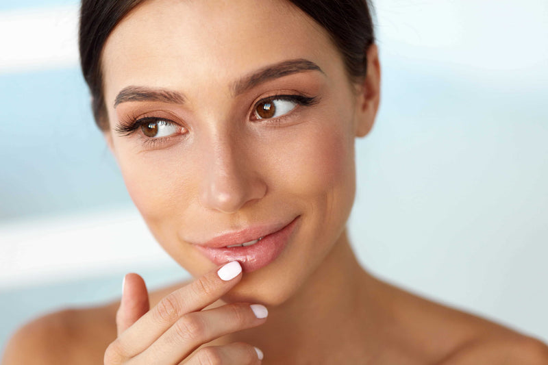 Summer beauty portrait highlighting full-looking eyelashes