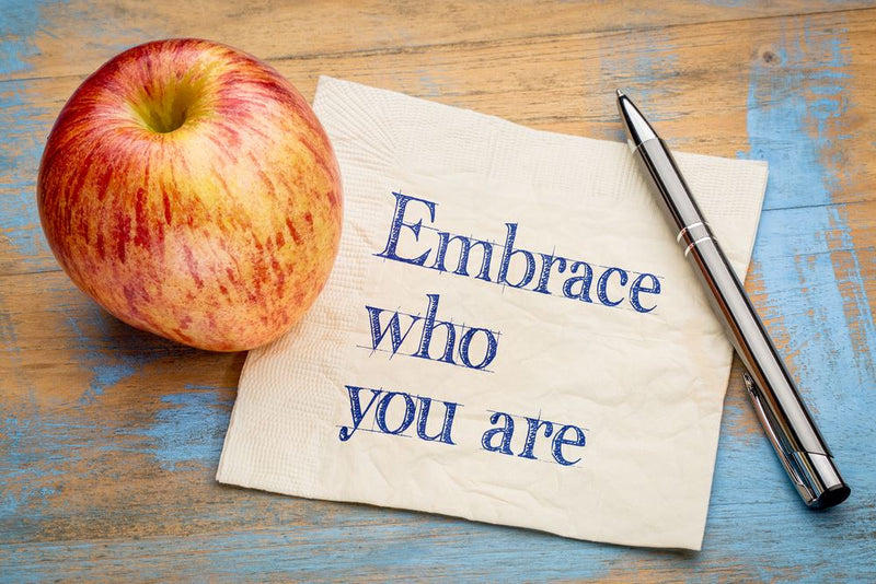 Self-acceptance note beside an apple