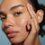 Close up model photo posing with hand on cheek
