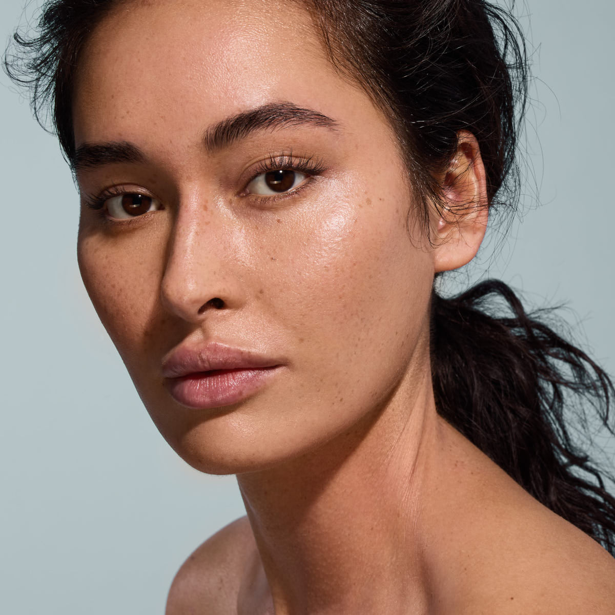 RapidLASH® close-up photo of model on a blue background